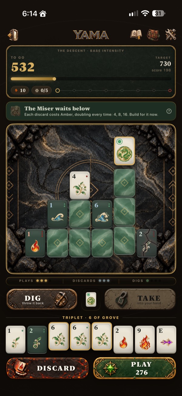 A round in play: the board with only its top tiles face up, and a formation picked out in hand, ready to play
